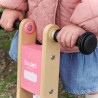 Draisienne bois rose pour enfant - Zoom sur la plaque frontale